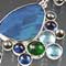 Silver, Pearl, Kyanite, Blue Topaz, Chrome Diopside, and Opal Doublet
